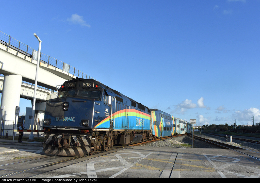 Tri-Rail F40PH-3C # 808 pushes Train # 666 away from the MIC toward its next stop at Hialeah Market Station